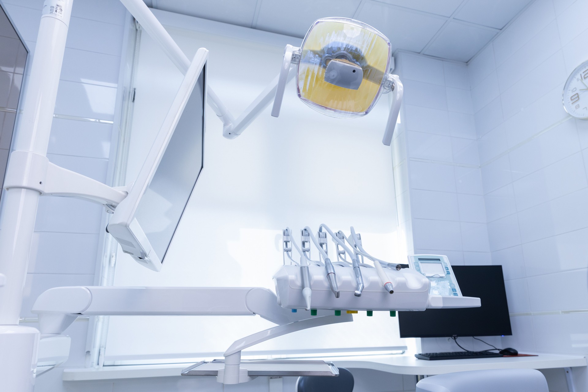 Modern Dental Office Interior Featuring Advanced Equipment and Technology for Patient Care and Comfort with Bright Lighting and Organized Space for Efficiency